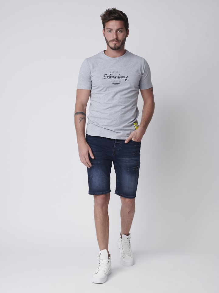 ברמודה ג`וגר ג`ינס עם קרעים ואטומים ואפקט שטיפה