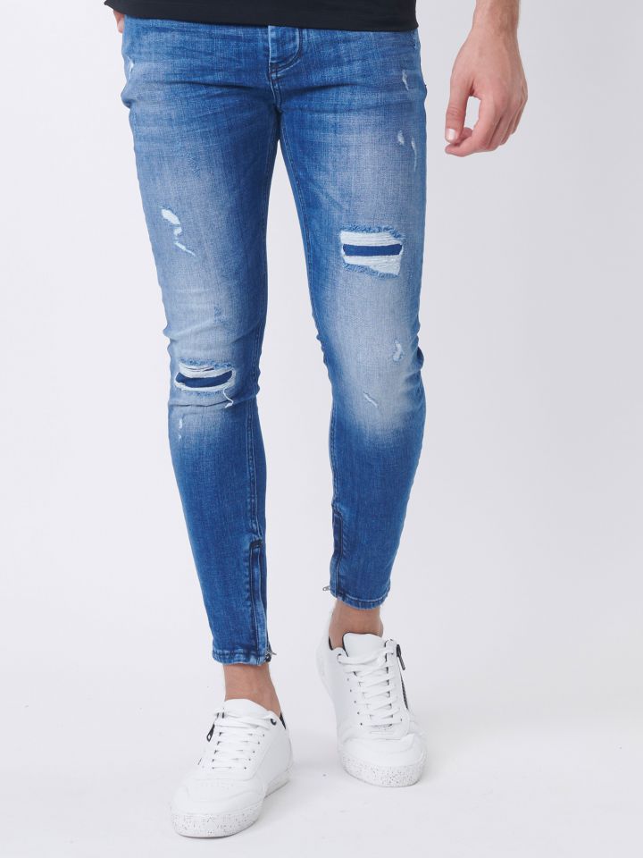 ג`ינס סקיני עם רוכסנים בקרסול