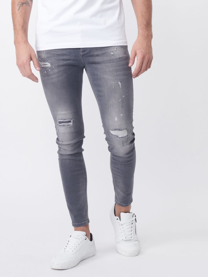 ג`ינס אפור עם אפקט שטיפה וקרעים