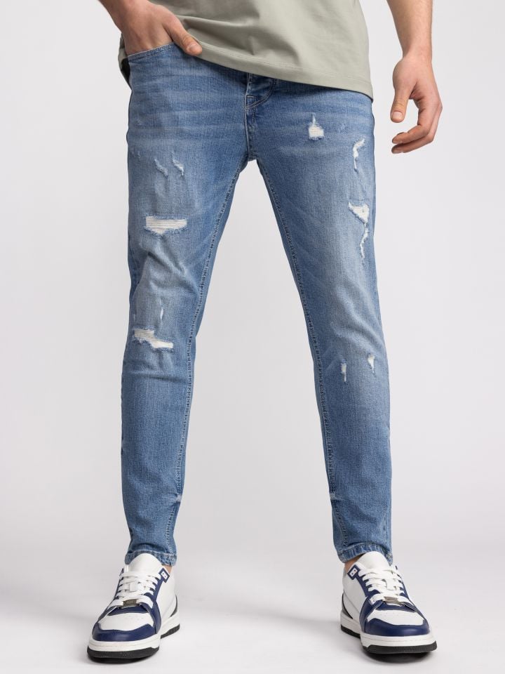 גינס סקיני בהיר עם קרעים עדינים