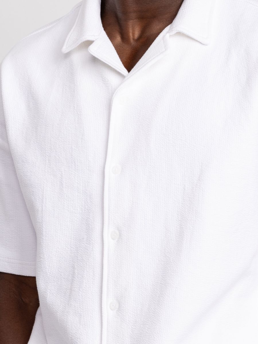 חולצה מכופתרת קצרה לגבר ריזורט