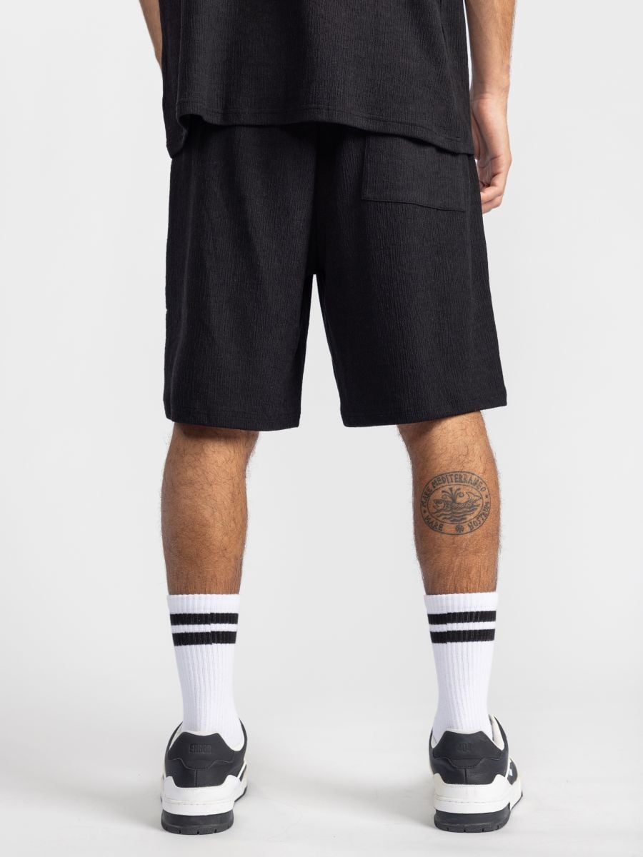 מכנסי ריזורט מבד טקסטורלי