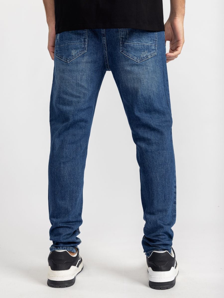 גינס סקיני עם קרעים ורוכסנים בסיומת