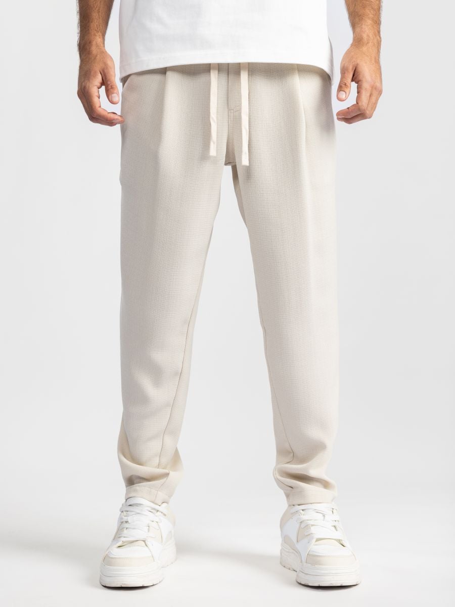 מכנסי בד טקסטורליים עם גומי ושרוך לגבר